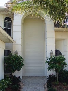 Storm Smart Aluminum Roll Down Shutters on a tall entry